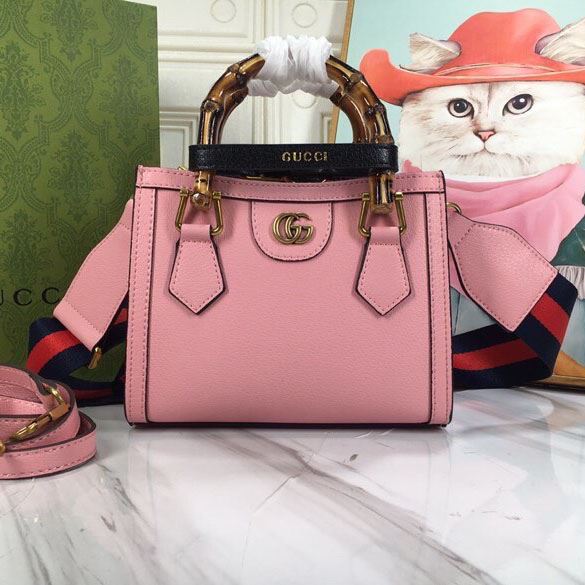 G*u*i top handle bags